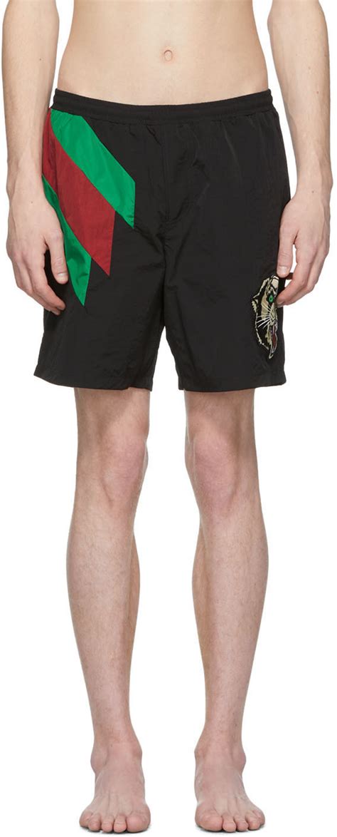 gucci tiger swim shorts|More.